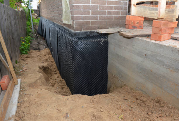 Happy homeowners after waterproofing job in Camp Dennison